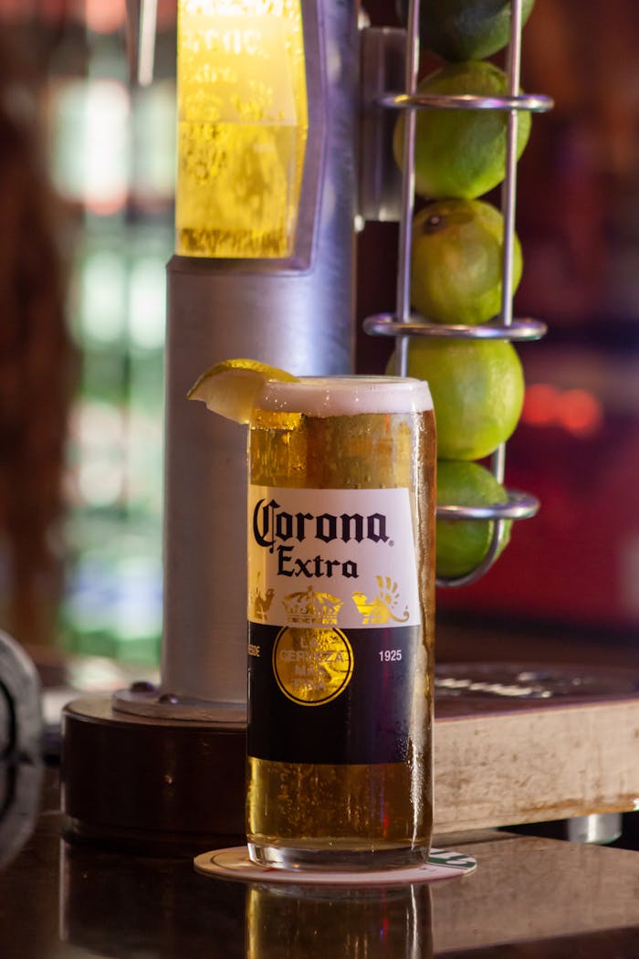 Chilled Corona Extra in a glass with lime slice at an Aberdeen bars counter.