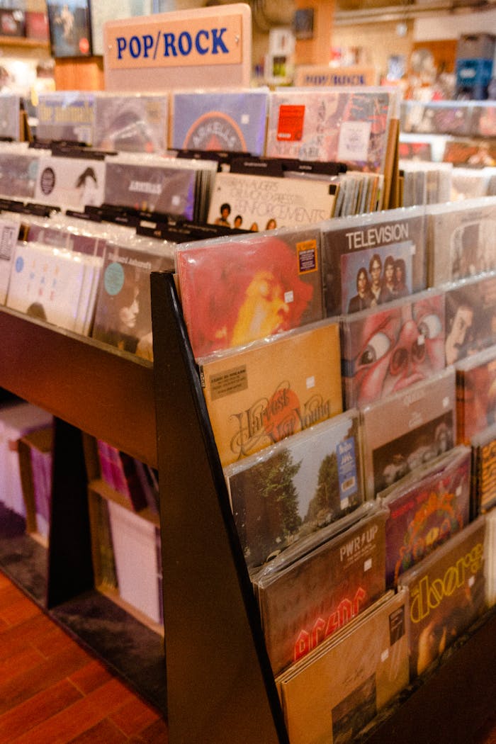 A vibrant collection of vinyl records in a music stores pop/rock section, perfect for music enthusiasts.