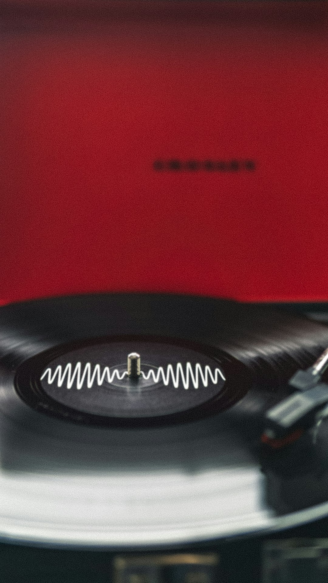 black-vinyl-record-on-vinyl-record-player-6zf4q4uk3ue